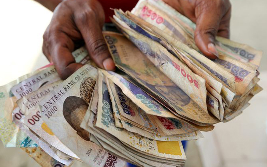 Naira weaker on lower oil prices, profit taking in the local debt market and others.